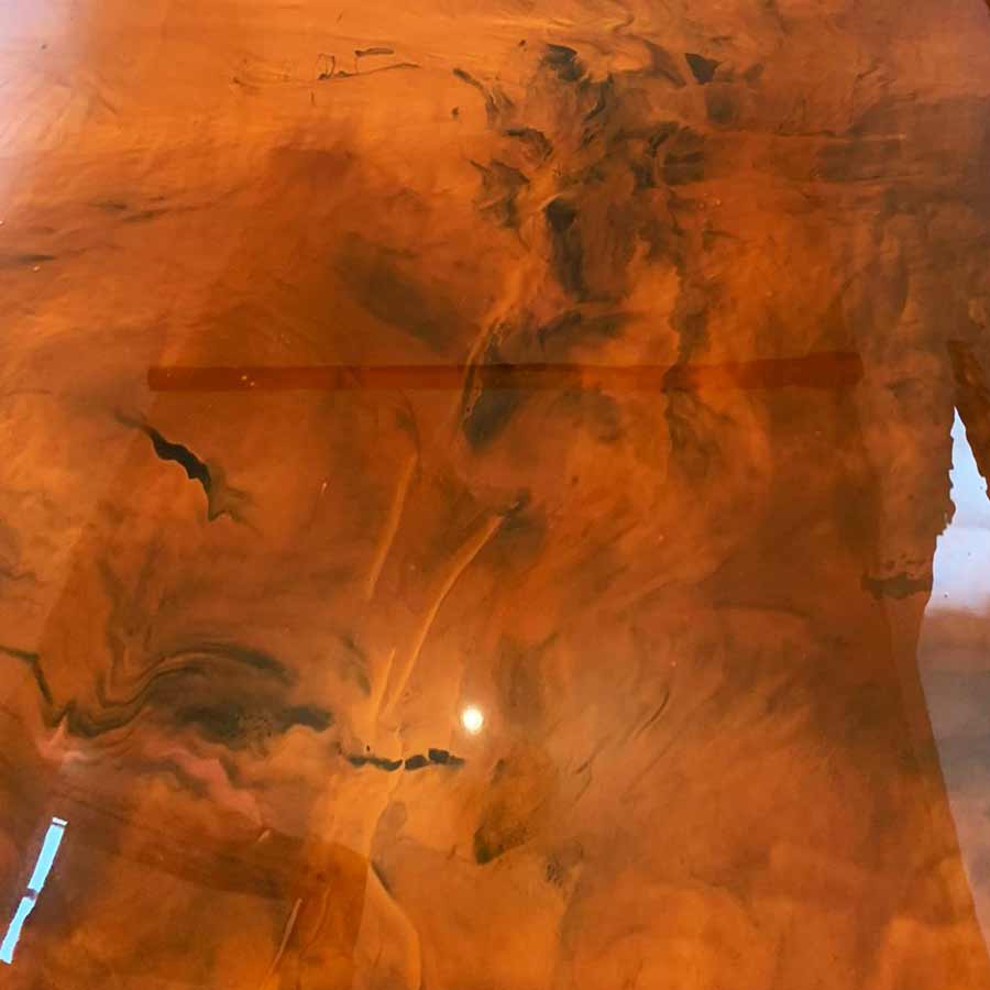Advantages of Metallic Epoxy Flooring - Reflective, glass-like surface with stunning depth and movement.